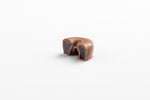 Single Smooth Milk Chocolate Coated Ring cut in half to reveal a chewy aniseed centre