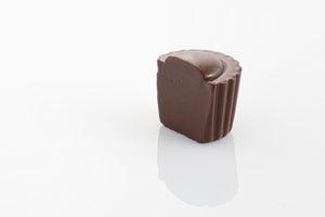 Single Classic Dark Truffle Cut in half to reveal smooth dark couverture chocolate