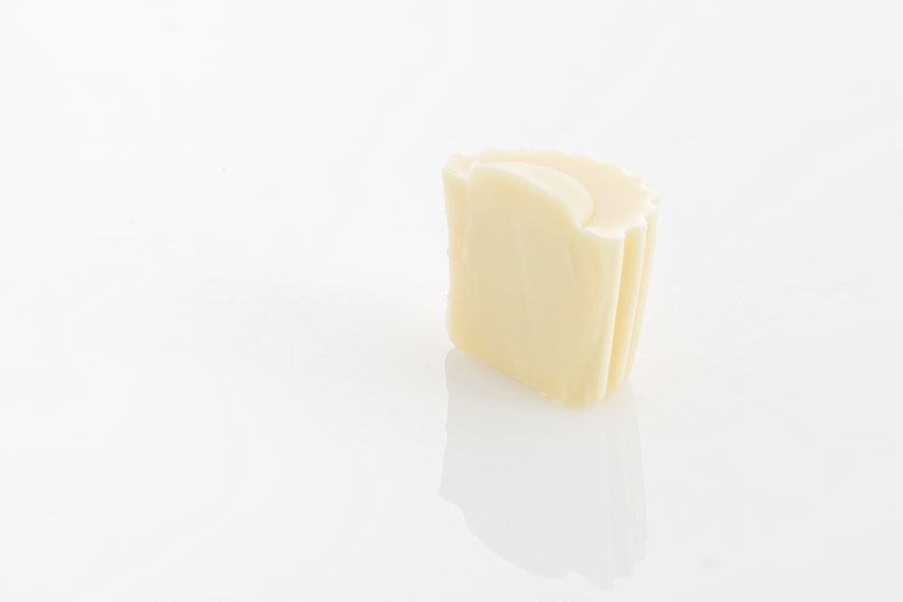 Single Classic White Truffle Cut in half to reveal mellow and creamy solid white couverture chocolate