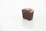 Single Dark Ganache Truffle Cut in half to reveal a rich dark chocolate ganache filling