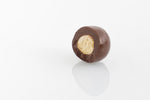 Single Dark Chocolate Coated Malt Ball cut in half