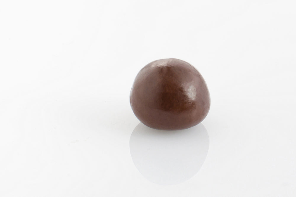 Single Chewy Raspberry encased in smooth dark couverture chocolate from Share Chocolates