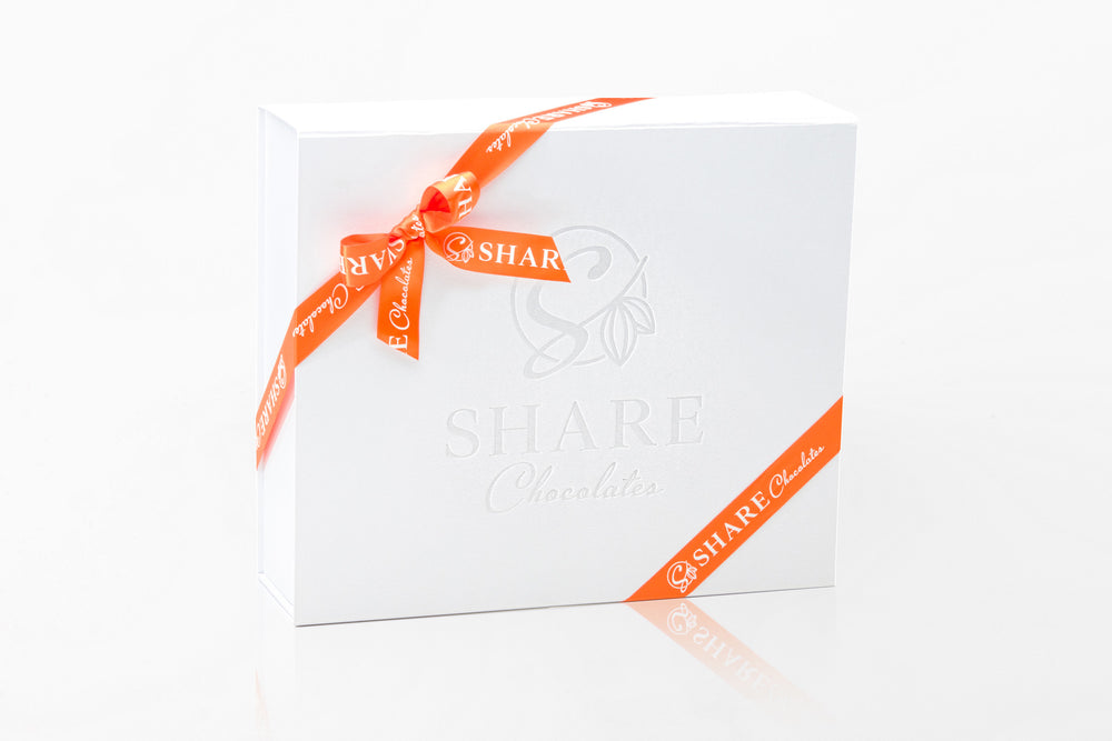 Share Chocolates Pearl White Luxurious Hamper Box wrapped with Orange Ribbon