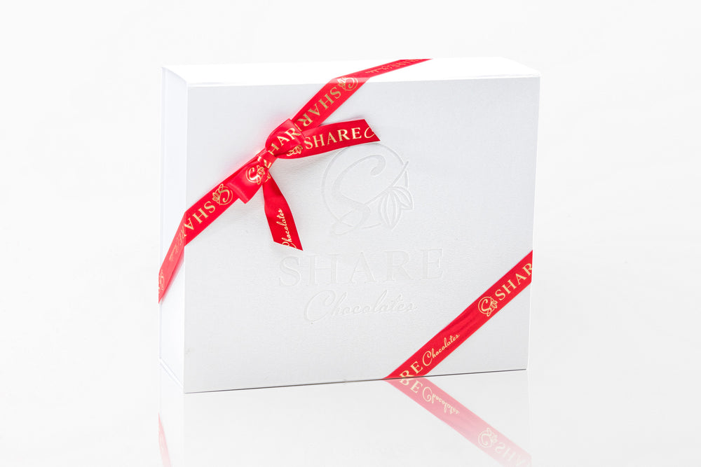 Share Chocolates Pearl White Luxurious Hamper Box wrapped with Red & Gold Ribbon