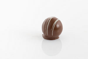 Chocolate Fudge ganache filling encased in pure milk chocolate with a striped white chocolate decoration