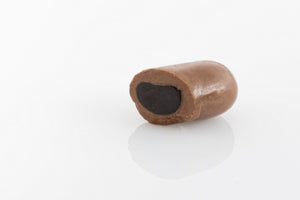 Single Jumbo Sized Milk Liquorice Bullet cut in half