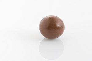 Single whole macadamia coated in creamy 27% cocoa milk couverture chocolate from Share Chocolates