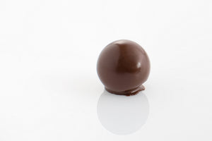 Plum Pudding Ball - Aromatic plum pudding truffle filling enrobed in rich dark couverture chocolate ball