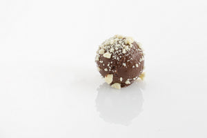 Vanilla Ganache - A smooth vanilla and white couverture chocolate truffle centre, enrobed with milk couverture chocolate with a white chocolate crumb topping