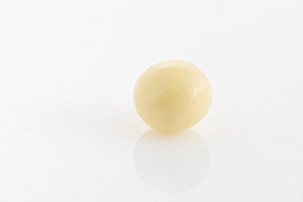 Single Malt Ball center encased in smooth white couverture chocolate from Share Chocolates