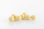 Group of Malt Balls coated in couverture white chocolate from Share Chocolates