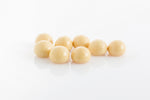 Group of chewy raspberries encased in smooth white couverture chocolate from Share Chocolates