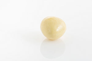 Single Crispy freeze dried strawberry coated in creamy white couverture chocolate from Share Chocolates