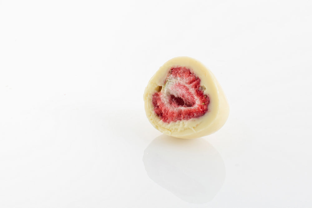 Single Dark Freeze Dried Strawberry cut in half 